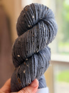 Blue tweed yarn in natural light
