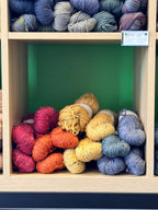 Colorful tweed yarn in a cubbie