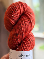 Orange tweed yarn in natural light