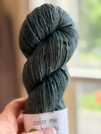 Green tweed yarn in natural light
