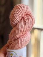 Light pink yarn in natural light
