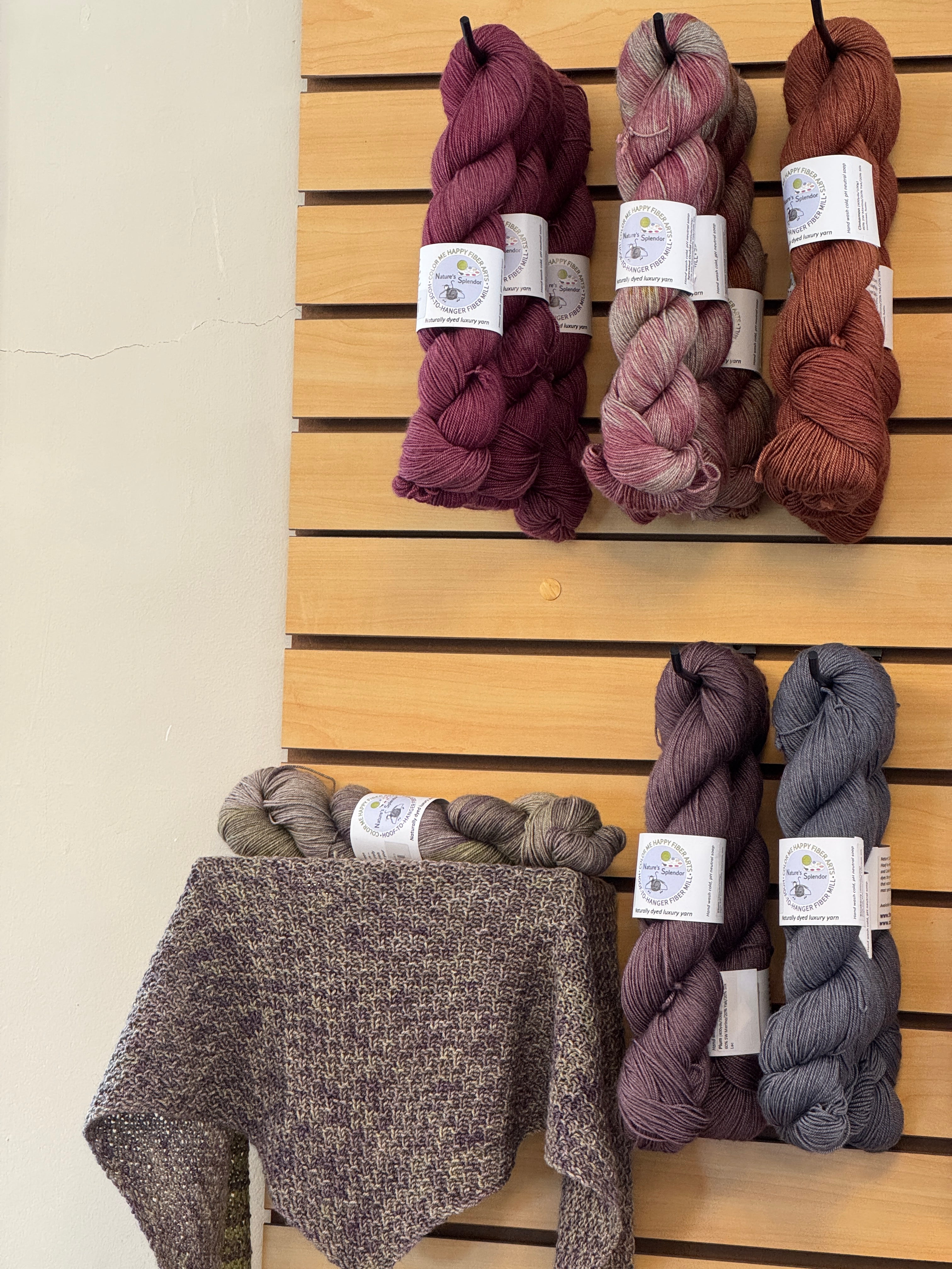 A lifestyle display photo of Color Me Happy Fiber Arts Studio Nature's Splendor Yak Sock weight yarn