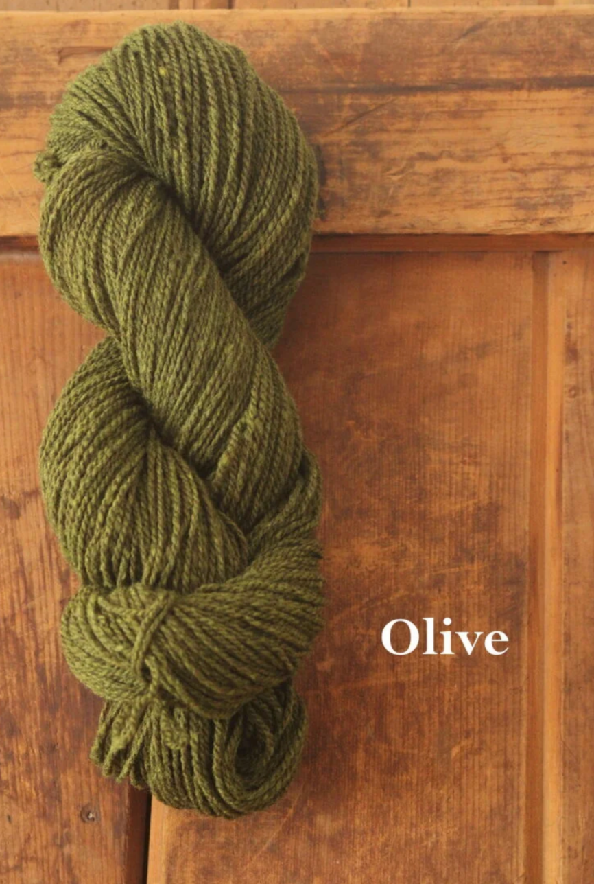 Olive green skein of yarn from Ewetopia on a wooden surface with 'Olive' text.