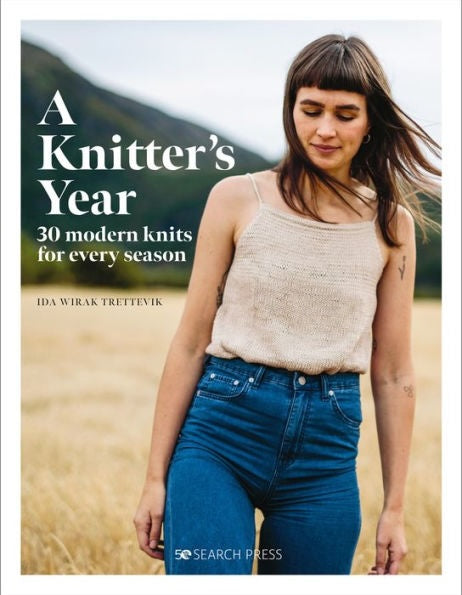 Book cover of 'A Knitter's Year' with a person wearing a knitted top in a field.