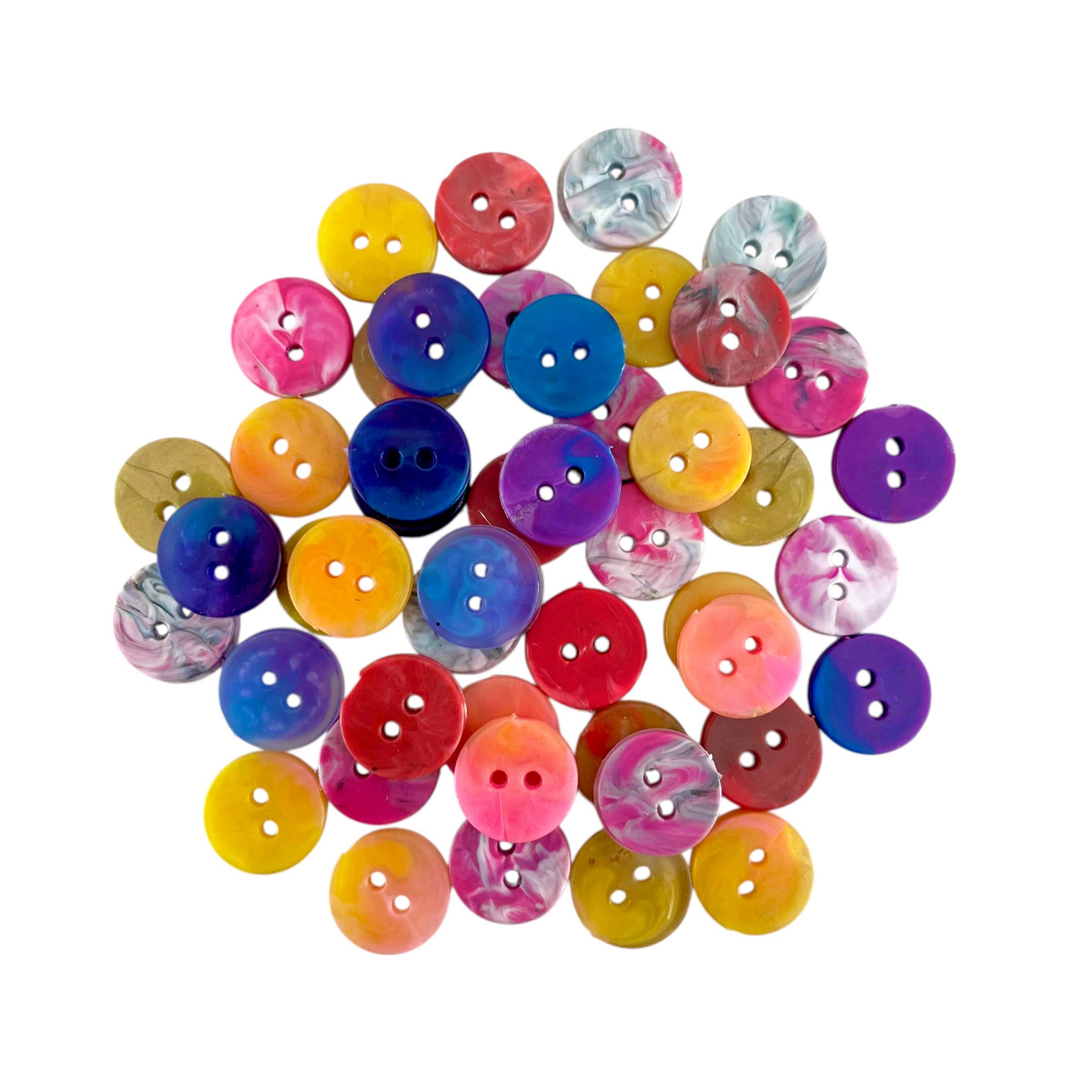 Assorted colorful buttons on a white background